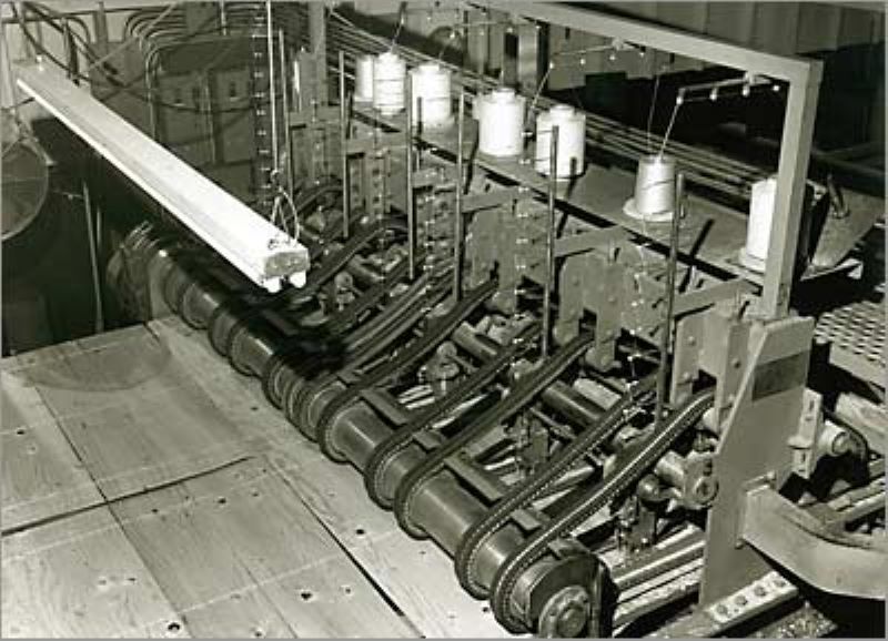 Early lumber manufacturing prototype machine designed by AST