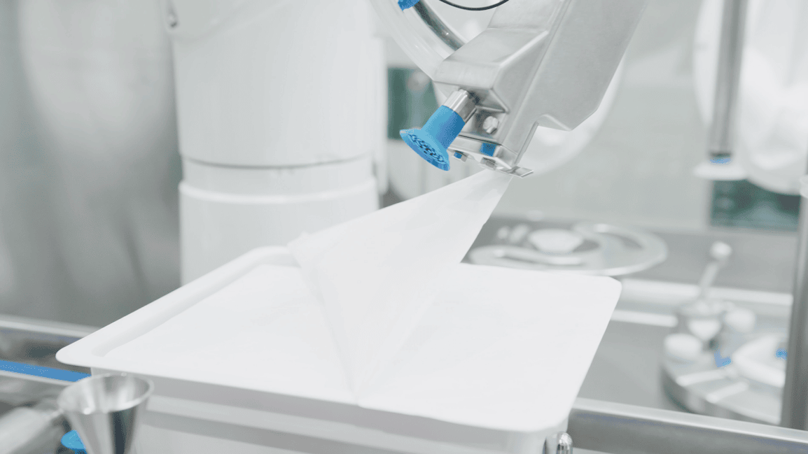 The Automatic Tub Opener (ATO) designed for minimal particle generation and hygienic trash disposal